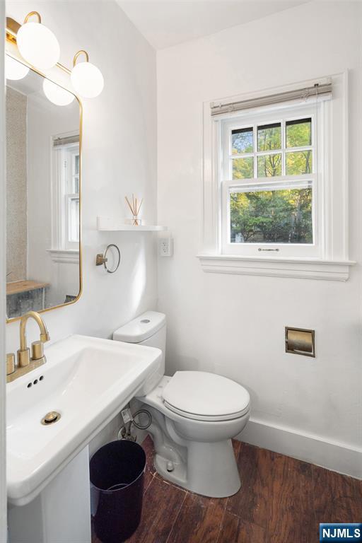 401 Conrad Road Englewood, NJ 07631 - Photo 19 of 42 a bathroom with a sink a toilet and a mirror