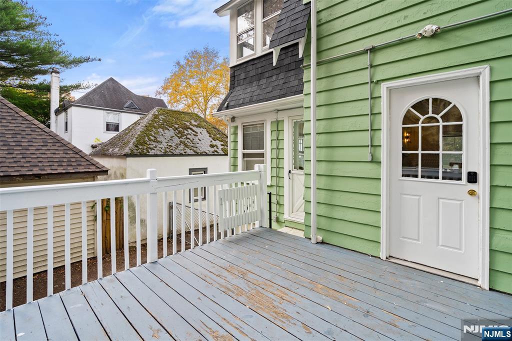 401 Conrad Road Englewood, NJ 07631 - Photo 35 of 42 a view of a house with a deck
