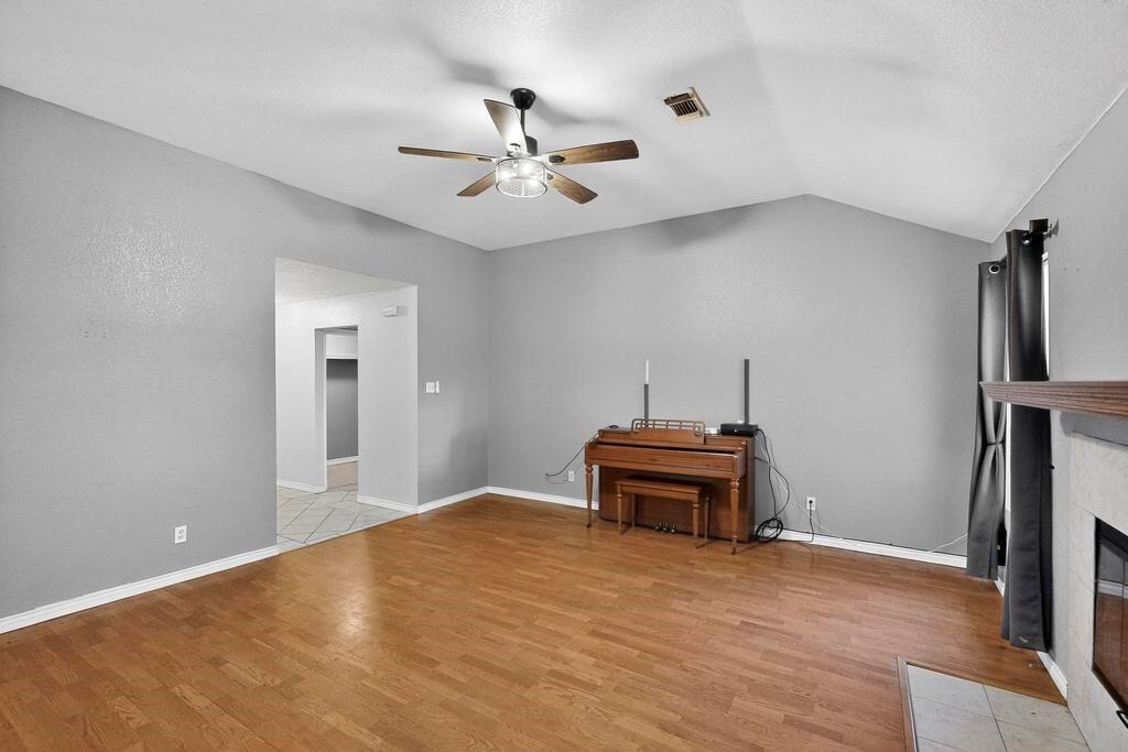 109 Pleasant Run Azle, TX 76020 - Photo 12 of 40 a view of a room with gym equipment
