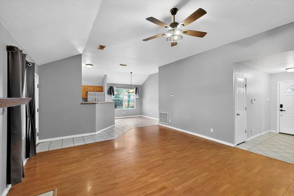 109 Pleasant Run Azle, TX 76020 - Photo 13 of 40 a view of an empty room with a kitchen