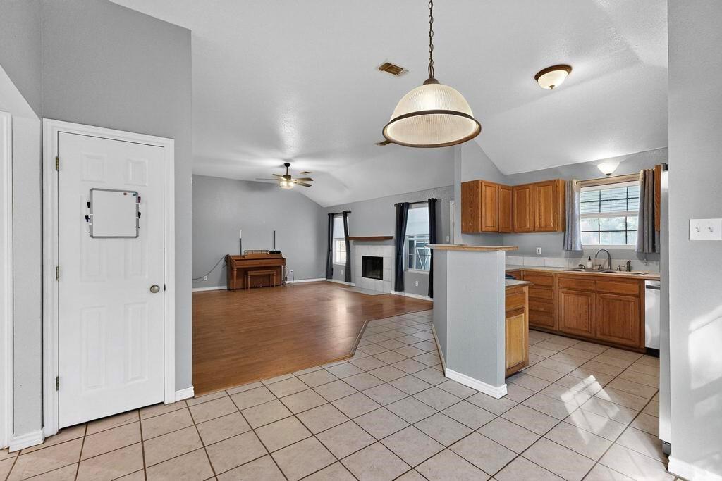 109 Pleasant Run Azle, TX 76020 - Photo 40 of 40 a view of a kitchen with a sink and a refrigerator