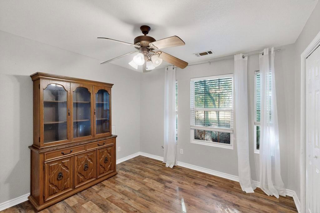 109 Pleasant Run Azle, TX 76020 - Photo 25 of 40 a view of an empty room with window and cabinet