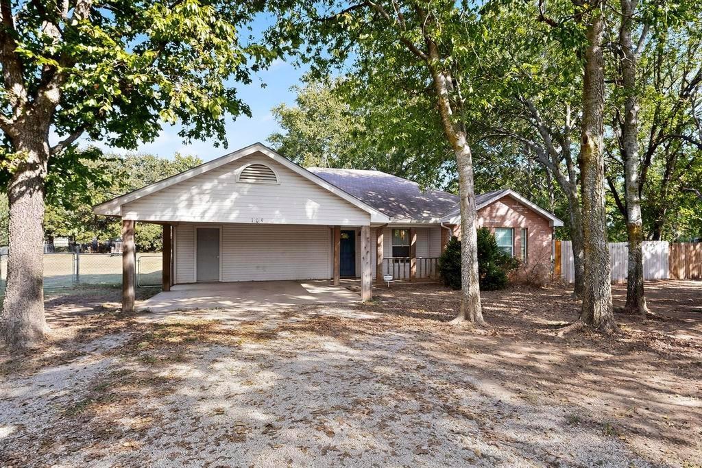 109 Pleasant Run Azle, TX 76020 - Photo 3 of 40 a front view of a house with a yard