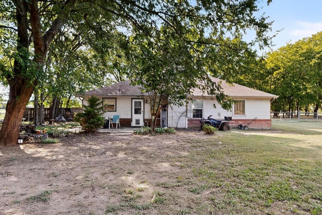 109 Pleasant Run Azle, TX 76020 - Photo 31 of 40 a front view of a house with a yard and trees