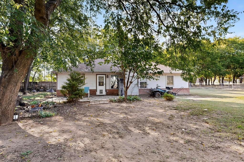 109 Pleasant Run Azle, TX 76020 - Photo 32 of 40 a view of a house with a yard