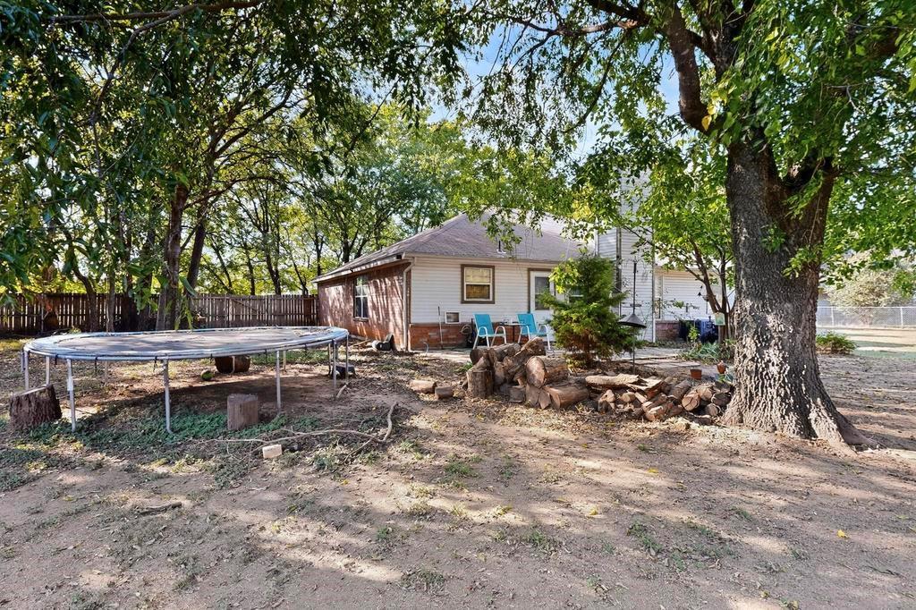 109 Pleasant Run Azle, TX 76020 - Photo 33 of 40 a view of a house with a backyard and sitting area