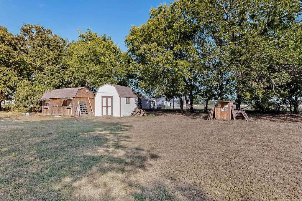 109 Pleasant Run Azle, TX 76020 - Photo 35 of 40 a view of a house with a yard