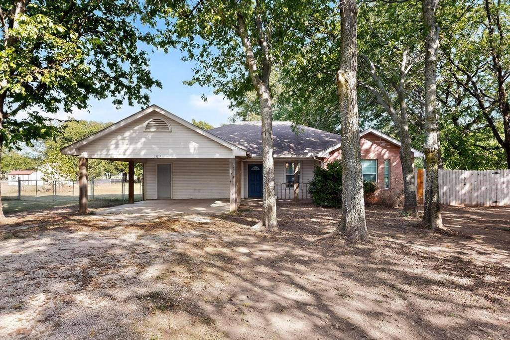 109 Pleasant Run Azle, TX 76020 - Photo 4 of 40 a house with trees in the background