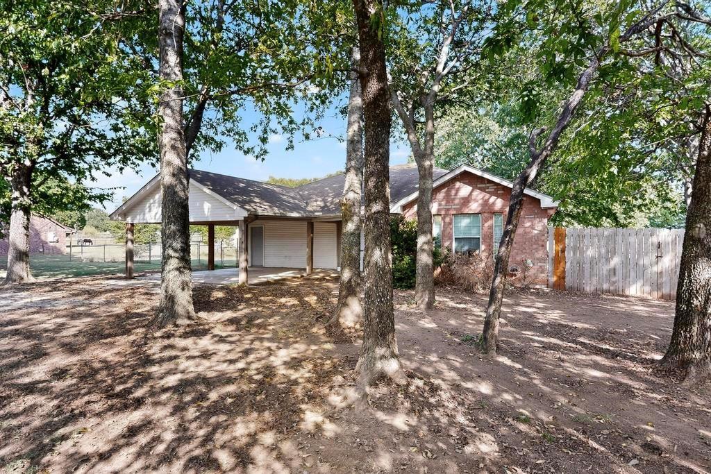 109 Pleasant Run Azle, TX 76020 - Photo 5 of 40 a view of a house with a yard