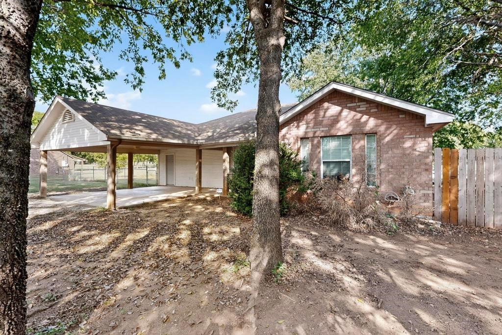 109 Pleasant Run Azle, TX 76020 - Photo 6 of 40 a view of a house with a yard