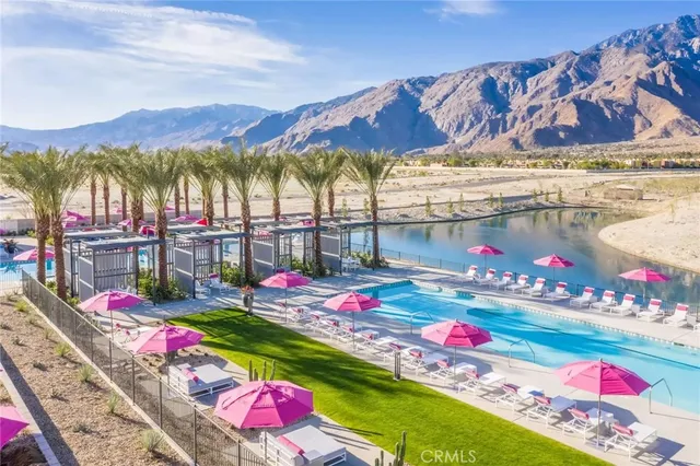 a view of swimming pool with an outdoor seating