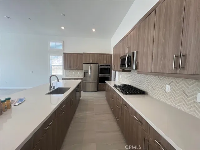 a kitchen with a stove and a microwave