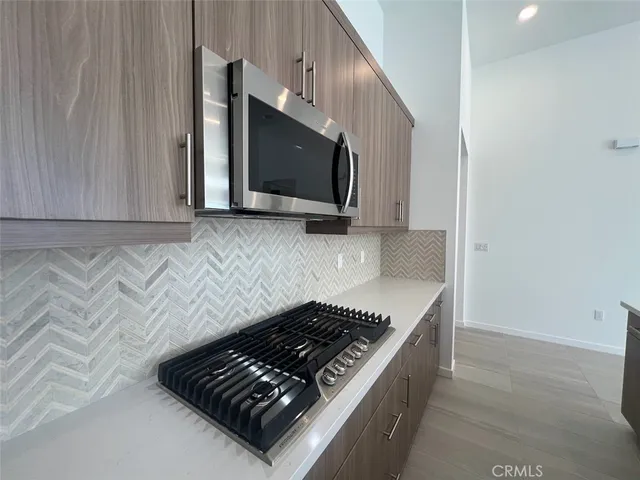 a kitchen with stainless steel appliances a refrigerator and a sink