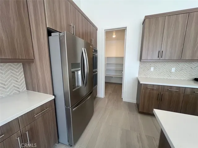 a view of an empty room with glass door