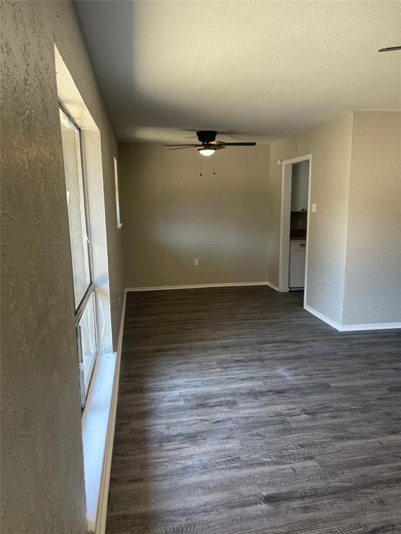 5526 Reiger Avenue, Unit 109 Dallas, TX 75214 - Photo 3 of 13 an empty room with wooden floor and entrance