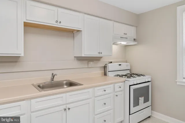 a view of a kitchen with a sink