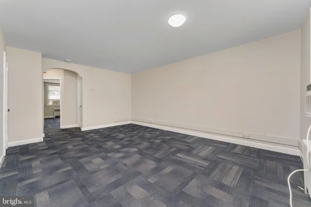 a kitchen with a refrigerator a sink and cabinets