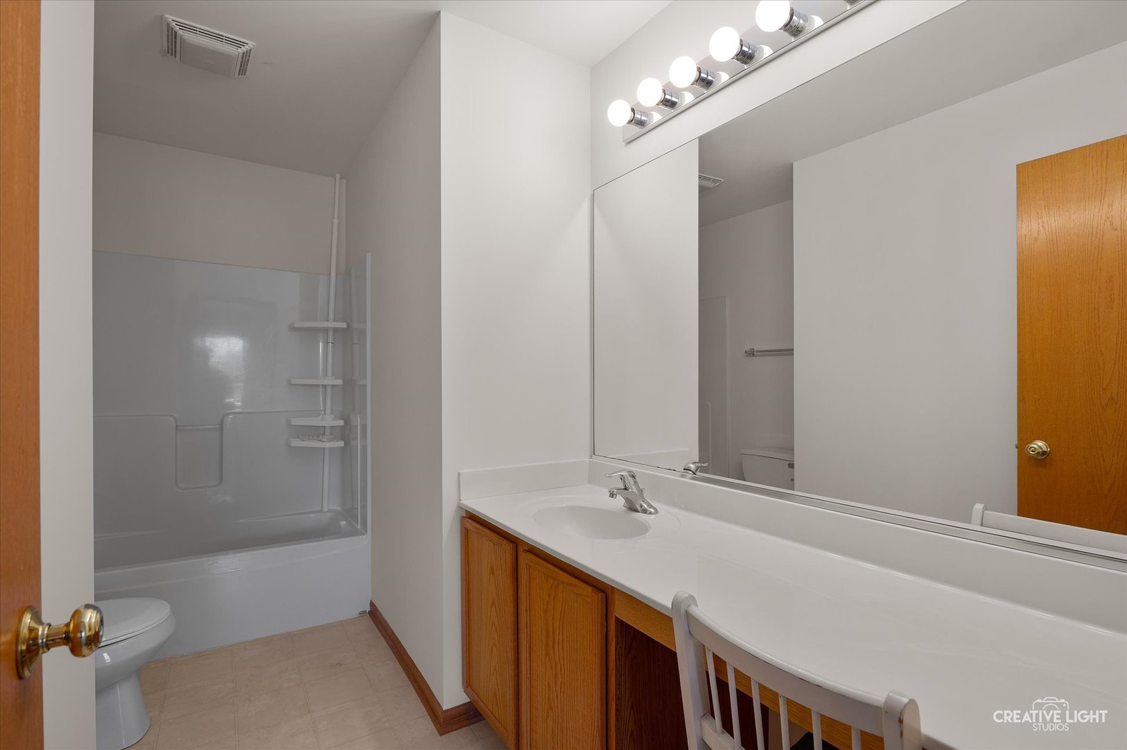 1603 Valley Ridge Drive Plainfield, IL 60586 - Photo 15 of 27 a bathroom with a double vanity sink and a mirror