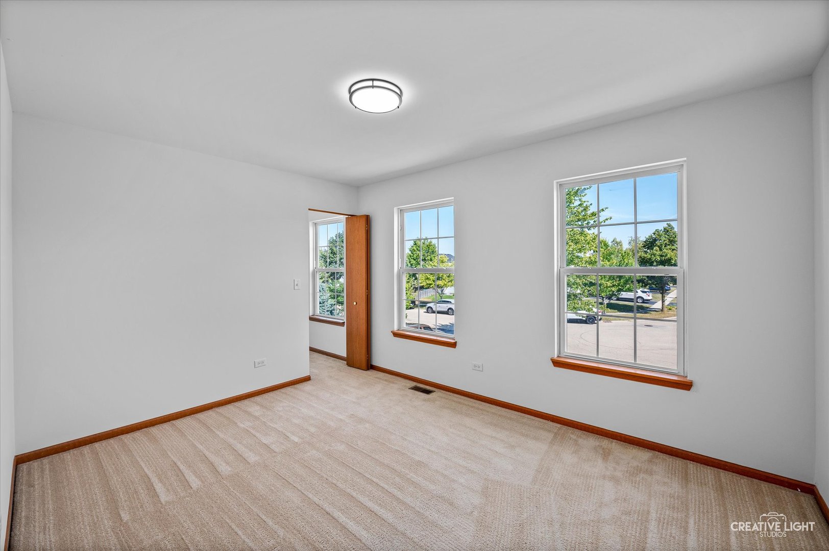 1603 Valley Ridge Drive Plainfield, IL 60586 - Photo 18 of 27 an empty room with windows
