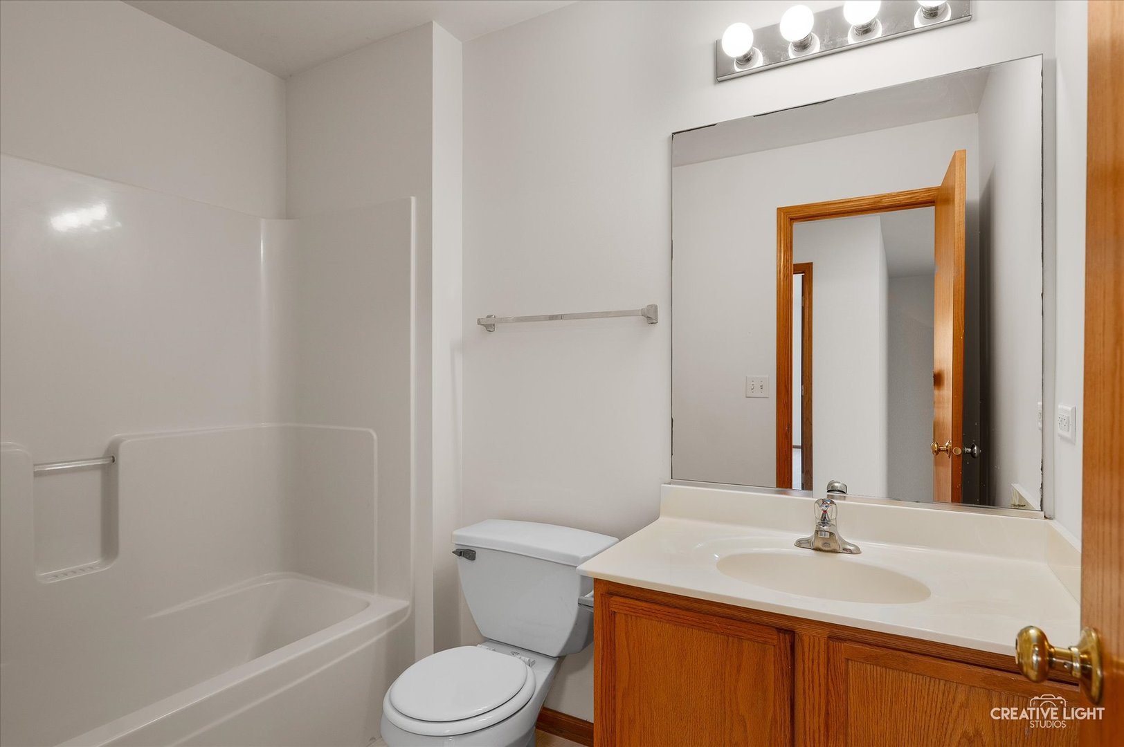 1603 Valley Ridge Drive Plainfield, IL 60586 - Photo 20 of 27 a bathroom with a sink toilet and shower