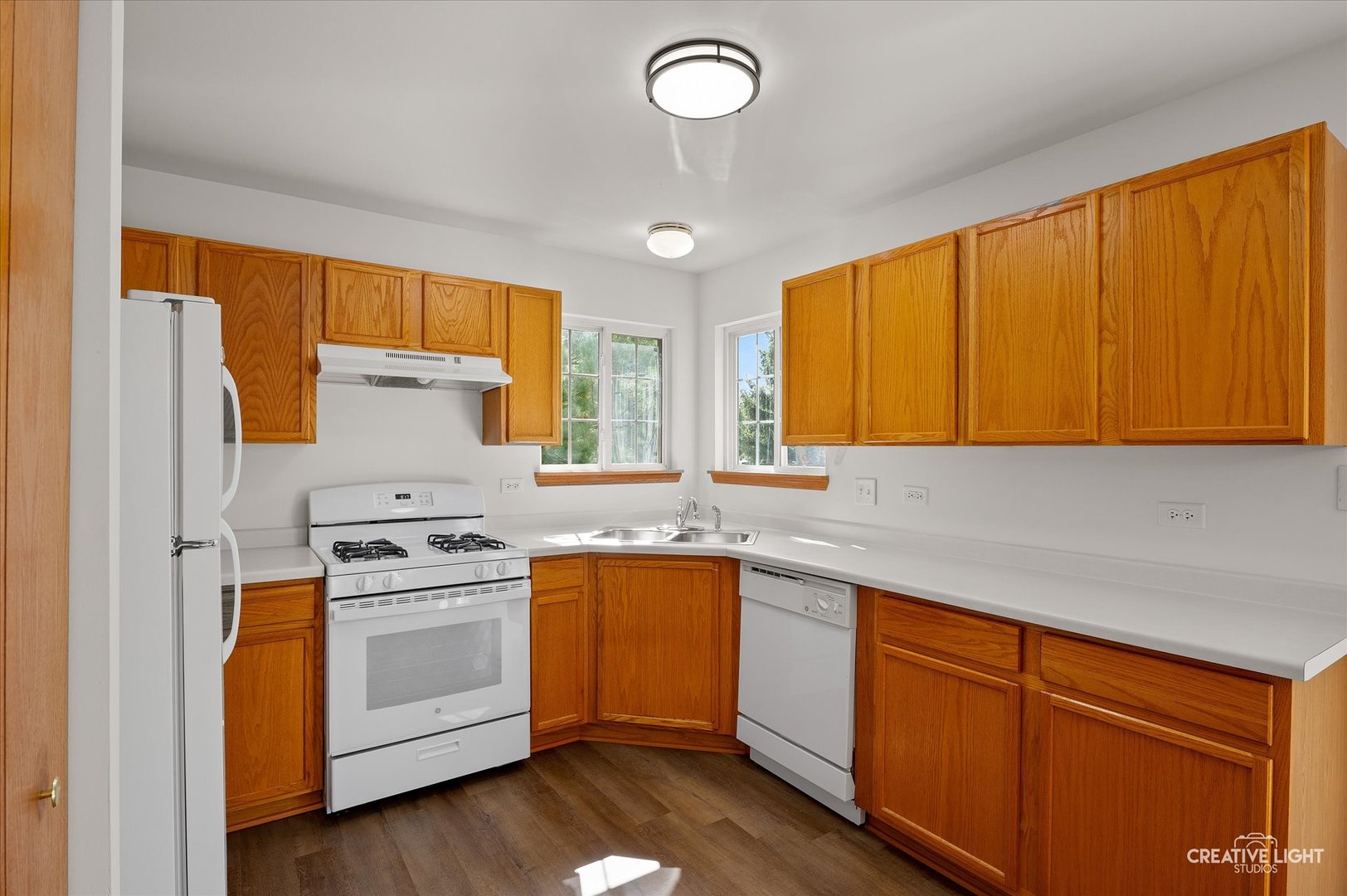 1603 Valley Ridge Drive Plainfield, IL 60586 - Photo 9 of 27 a kitchen with a sink cabinets stainless steel appliances and a window