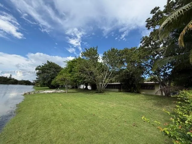 a view of a lake with a yard