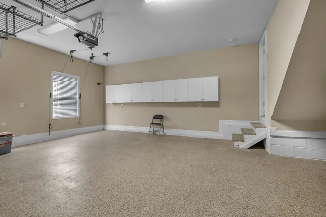 a view of a livingroom with a fireplace and a window