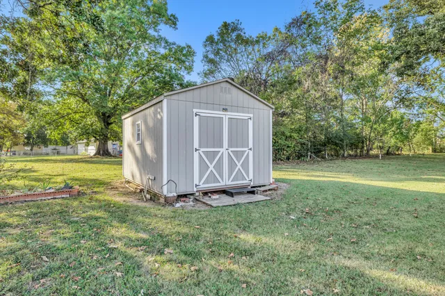 a house with garden in front of it