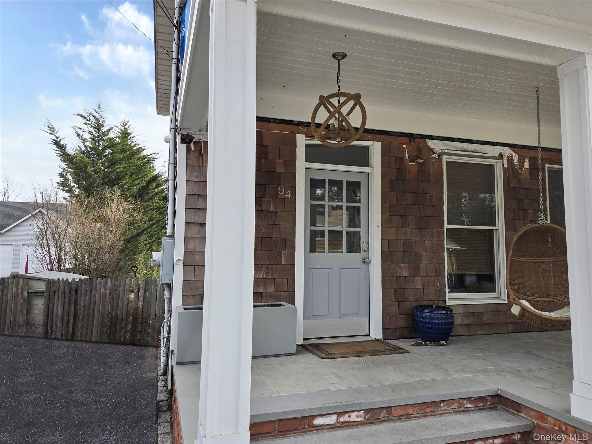 54 Cocks Lane Locust Valley, NY 11560 - Photo 4 of 6 a view of a house with a door and wooden floor