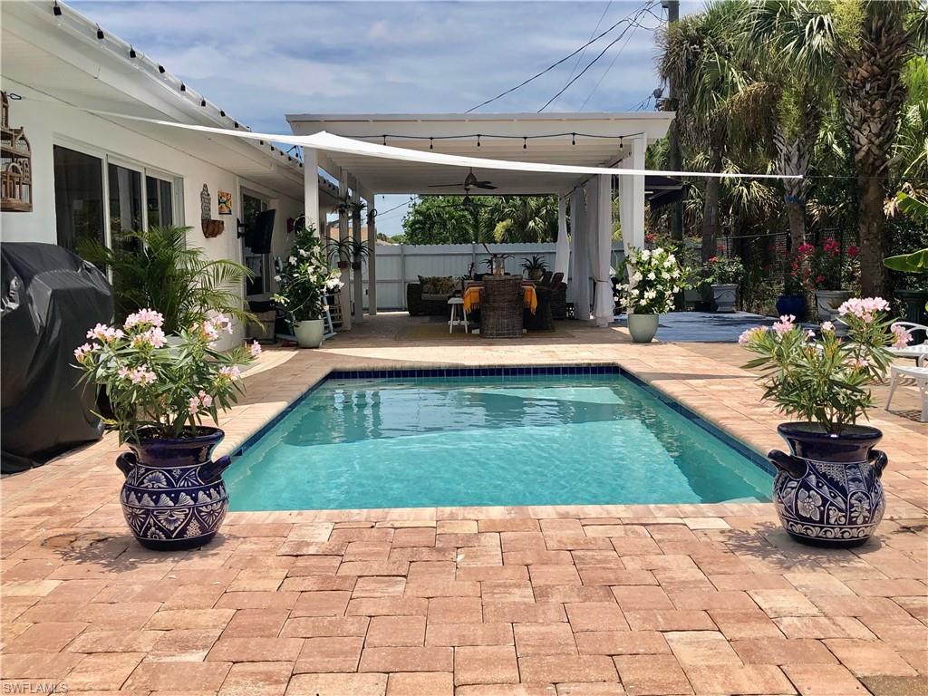 View of swimming pool featuring a patio area and a fenced backyard