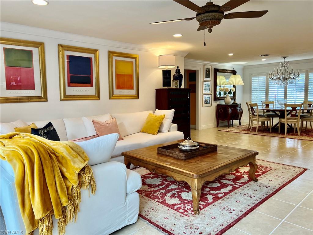 283 Cypress Way West Naples, FL 34110 - Photo 11 of 18 Bedroom featuring tile patterned flooring and a ceiling fan