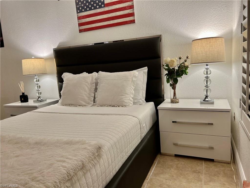 283 Cypress Way West Naples, FL 34110 - Photo 15 of 18 Single story home with stucco siding