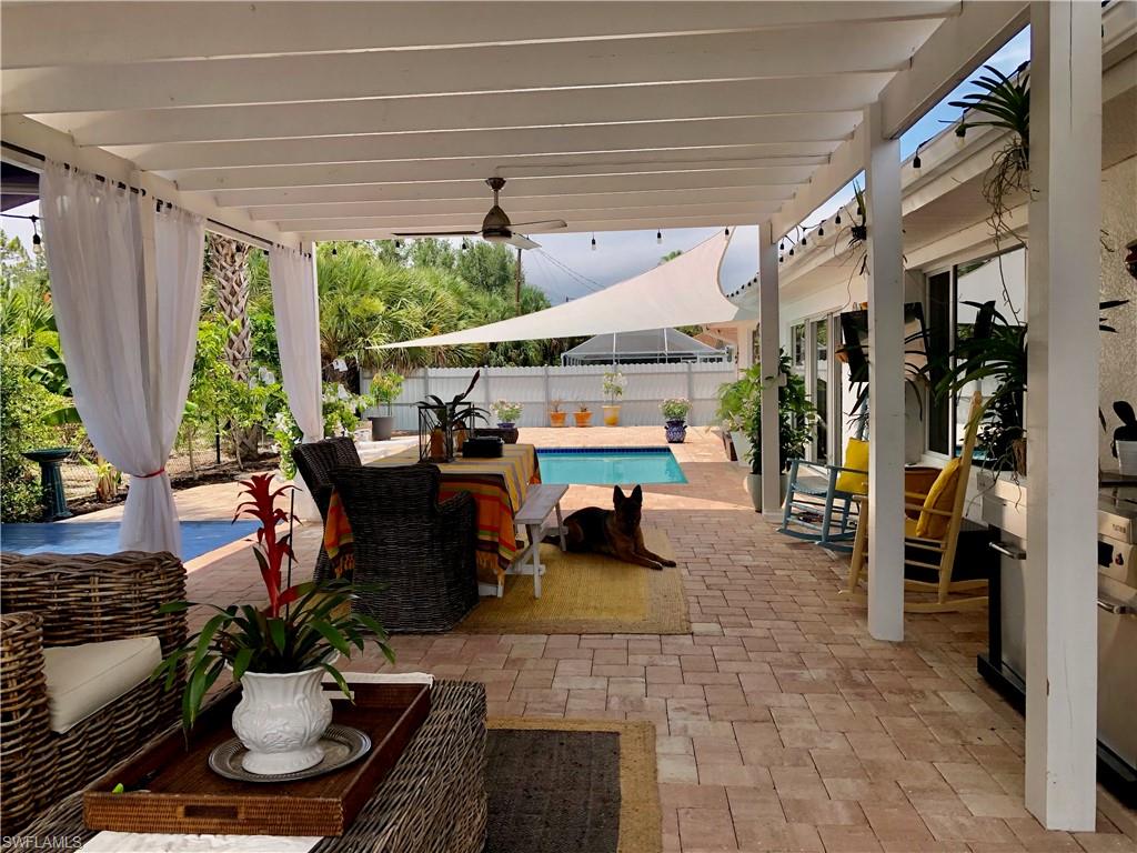 283 Cypress Way West Naples, FL 34110 - Photo 6 of 18 Workout room with baseboards and ornamental molding