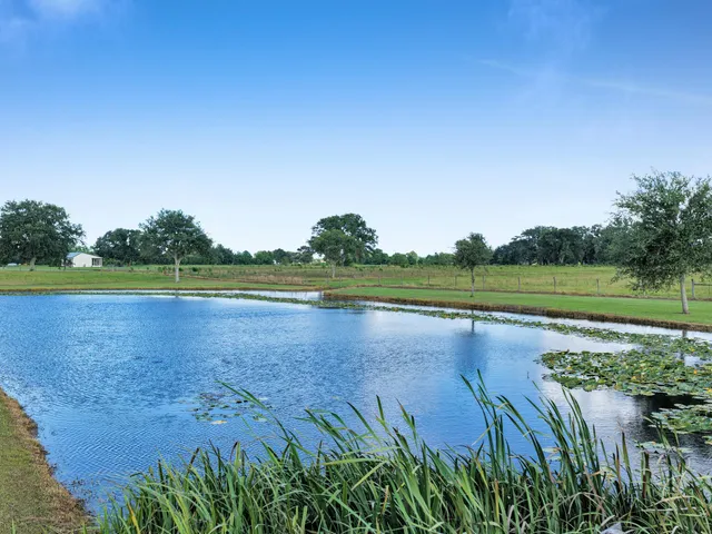 a view of a lake with a big yard
