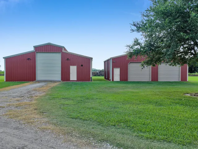 a front view of house with yard and trees