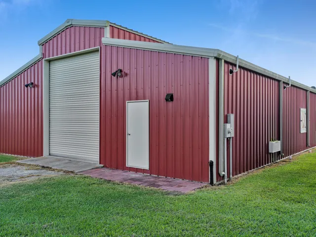 a view of a backyard with wooden fence