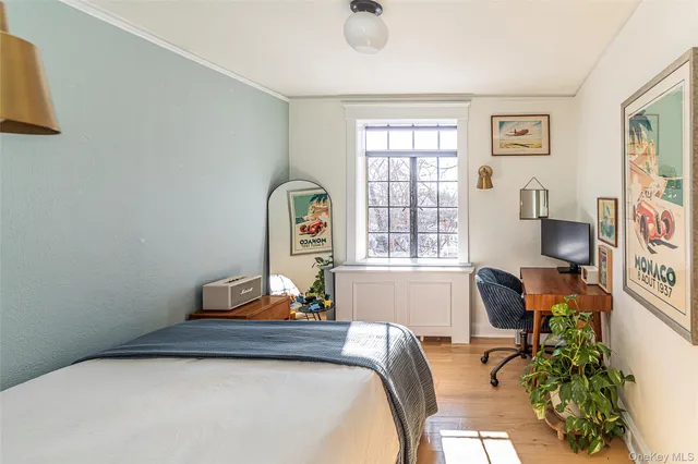 a bedroom with furniture and a window
