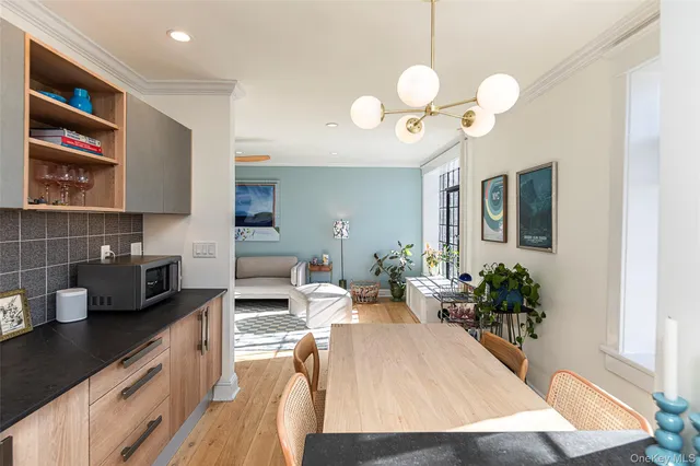 a kitchen with a table and chairs in it