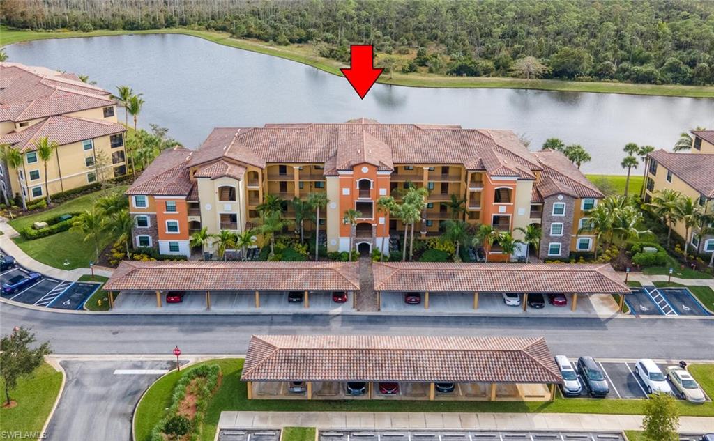 9731 Acqua Court, Unit 536 Naples, FL 34113 - Photo 2 of 48 an aerial view of house with yard