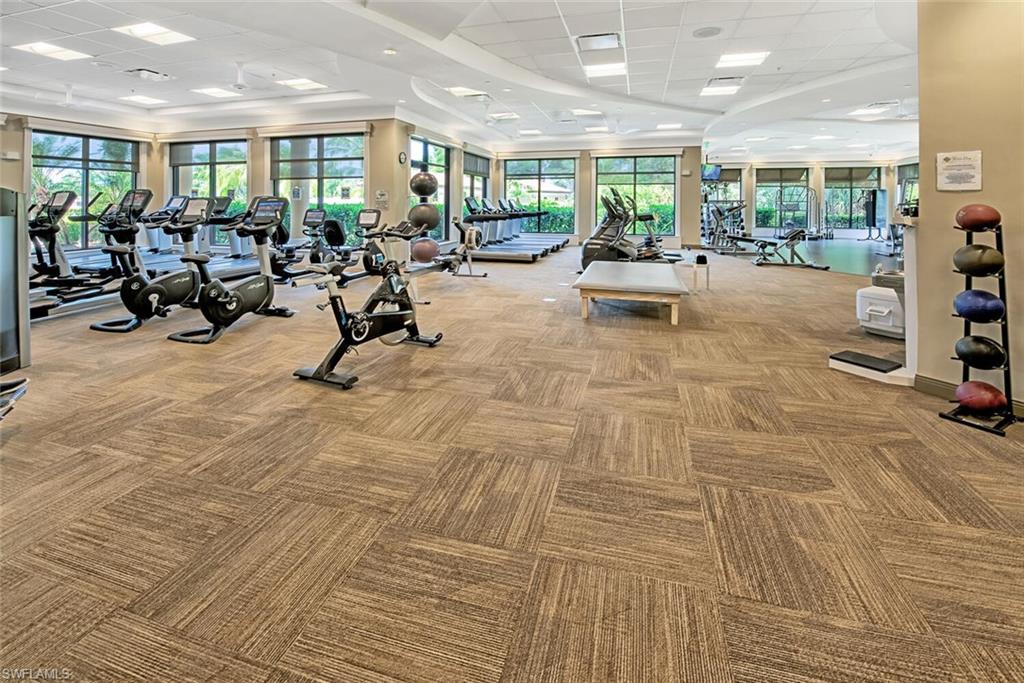 9731 Acqua Court, Unit 536 Naples, FL 34113 - Photo 35 of 48 a view of a room with gym equipment