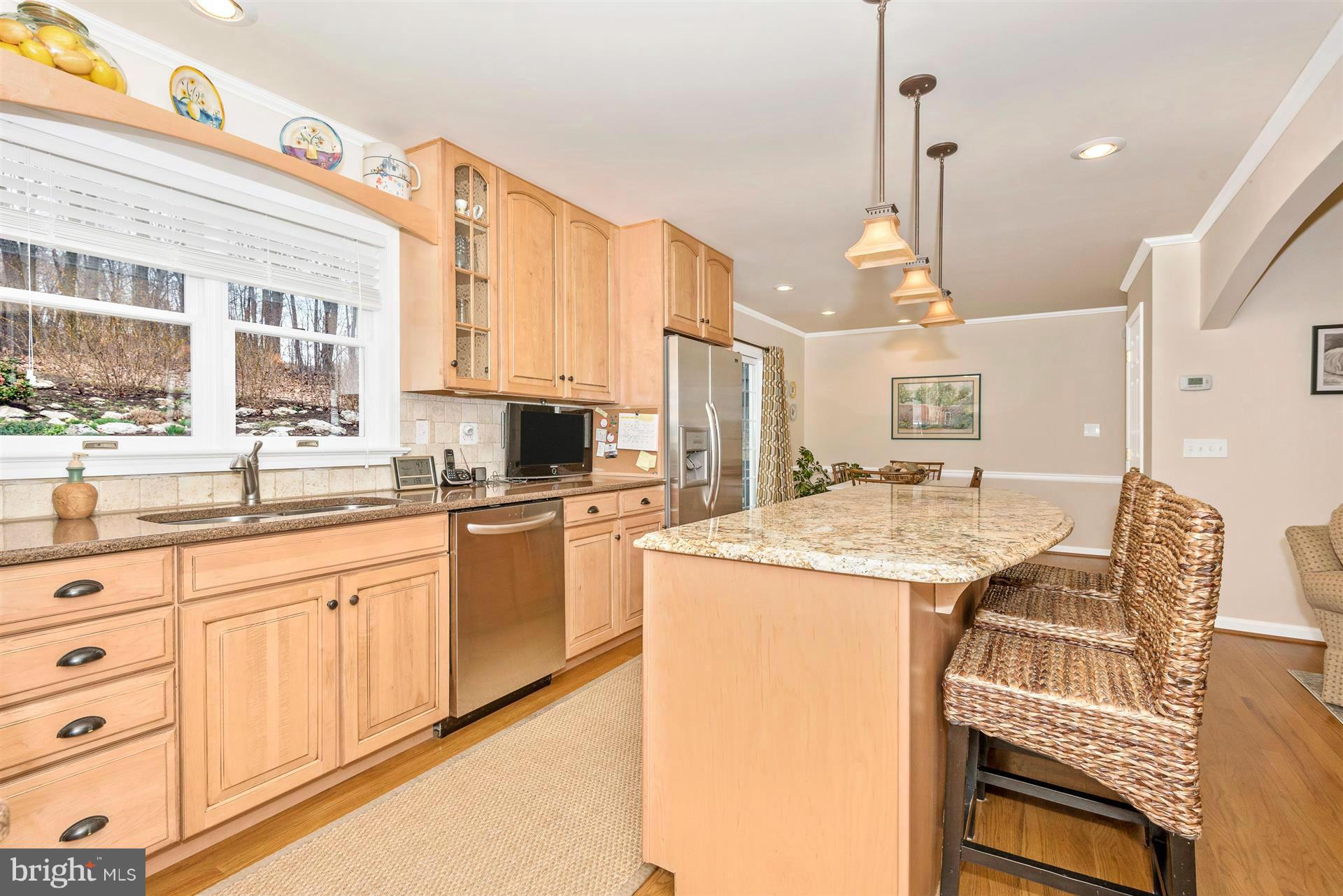 4230 Basford Road Frederick, MD 21703 - Photo 19 of 30 a kitchen with granite countertop white cabinets and white appliances