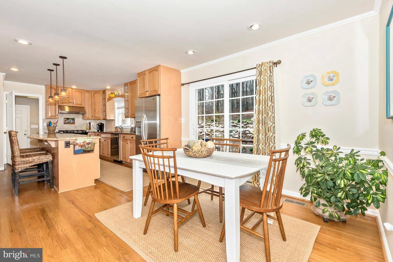 4230 Basford Road Frederick, MD 21703 - Photo 20 of 30 a dining room with furniture and wooden floor