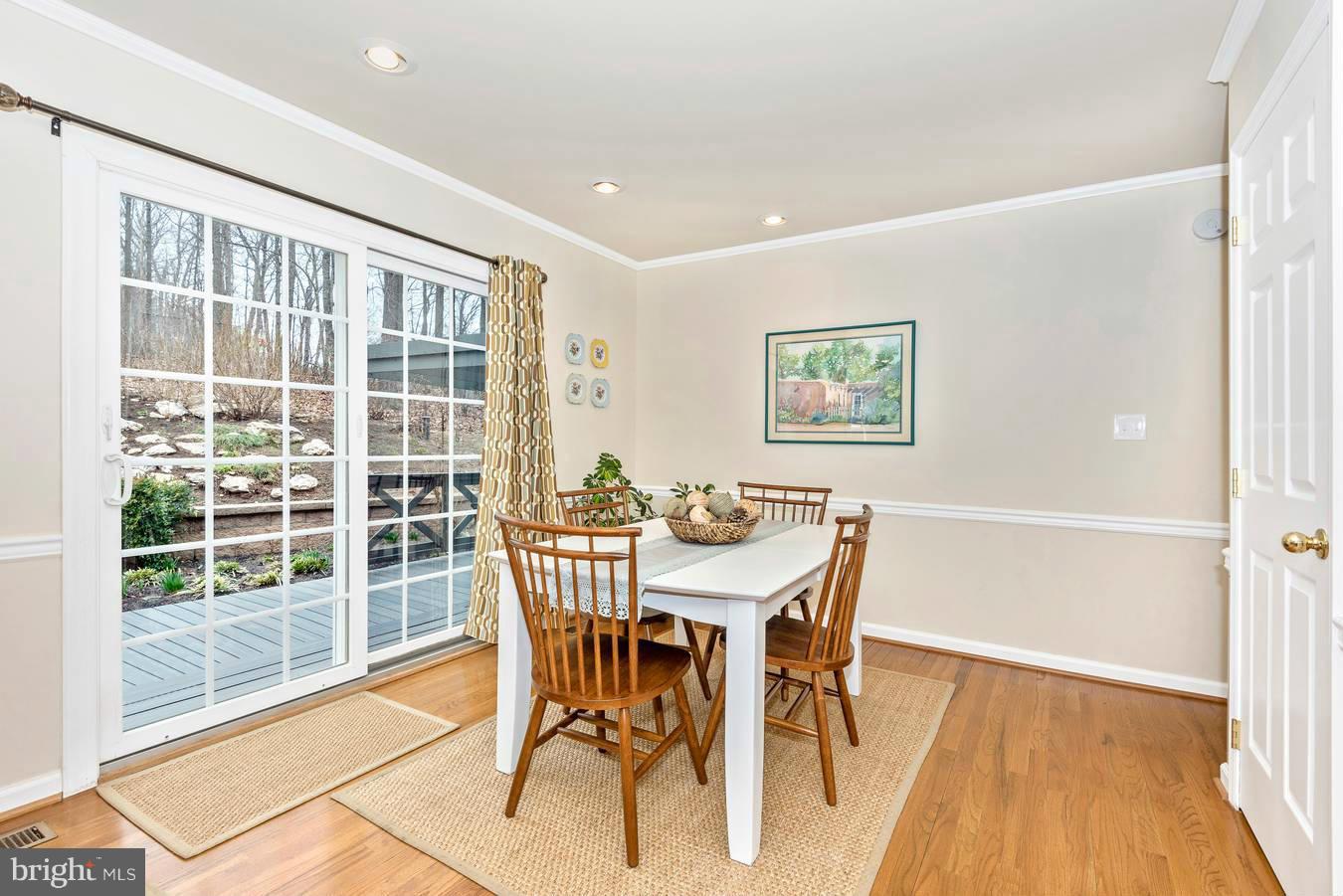 4230 Basford Road Frederick, MD 21703 - Photo 21 of 30 a view of a dining room with furniture and wooden floor