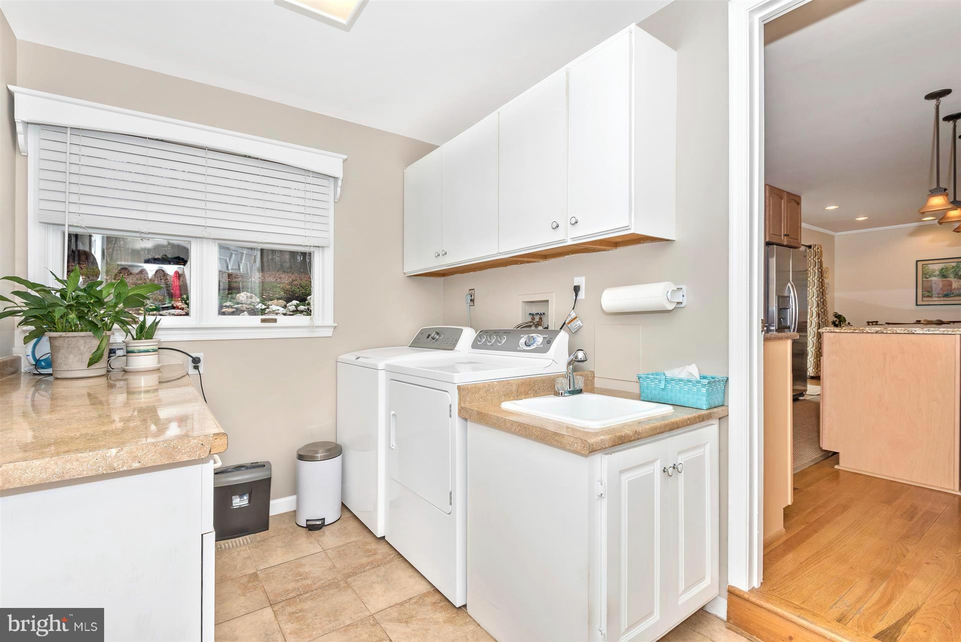 4230 Basford Road Frederick, MD 21703 - Photo 24 of 30 a kitchen with a sink and cabinets