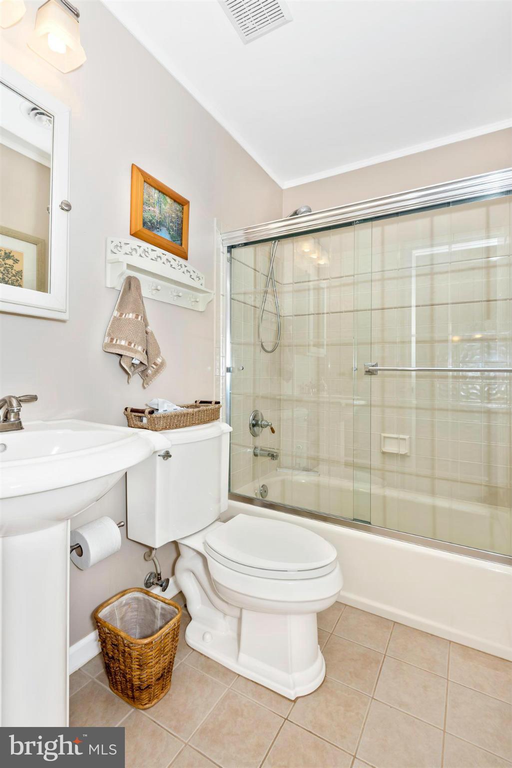 4230 Basford Road Frederick, MD 21703 - Photo 25 of 30 a bathroom with a sink a toilet and shower