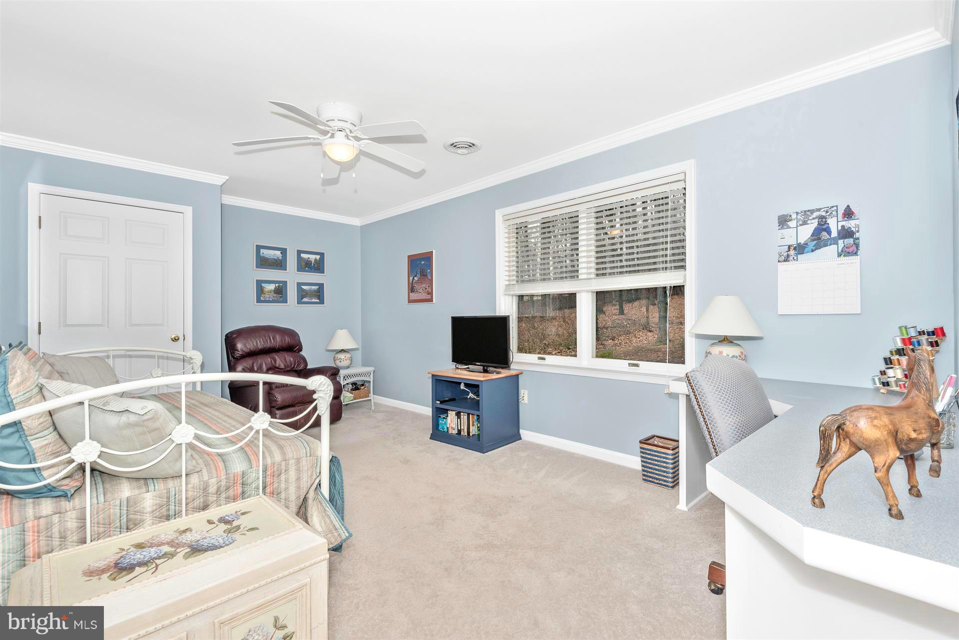 4230 Basford Road Frederick, MD 21703 - Photo 26 of 30 a living room with furniture and a flat screen tv