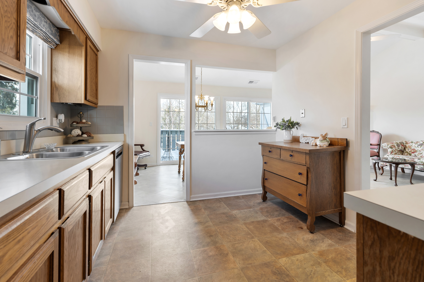 1907 Gresham Circle, Unit D Wheaton, IL 60189 - Photo 13 of 26 a kitchen with a sink stove and cabinets