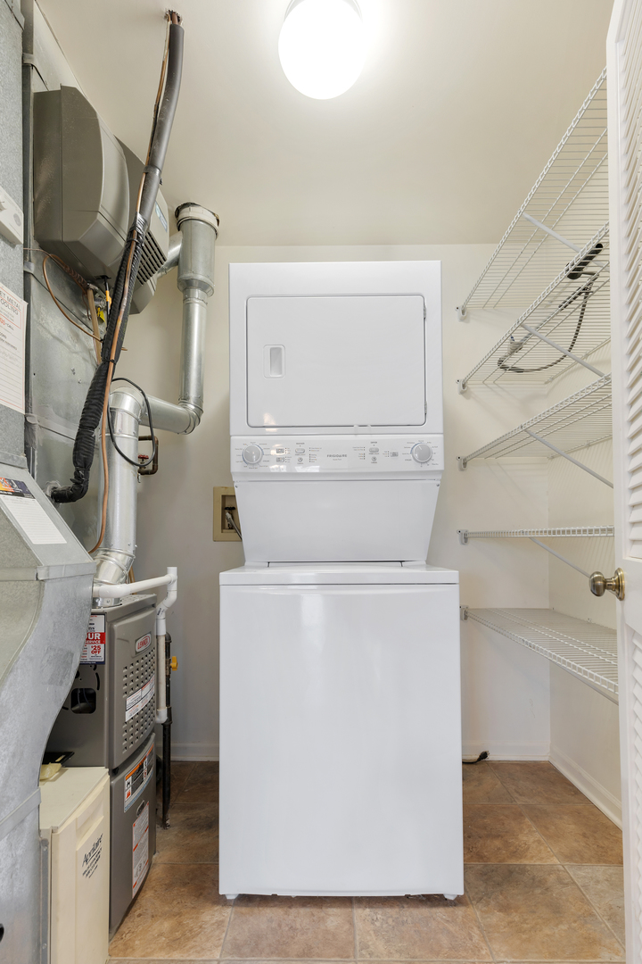 1907 Gresham Circle, Unit D Wheaton, IL 60189 - Photo 14 of 26 a utility room with dryer and washer