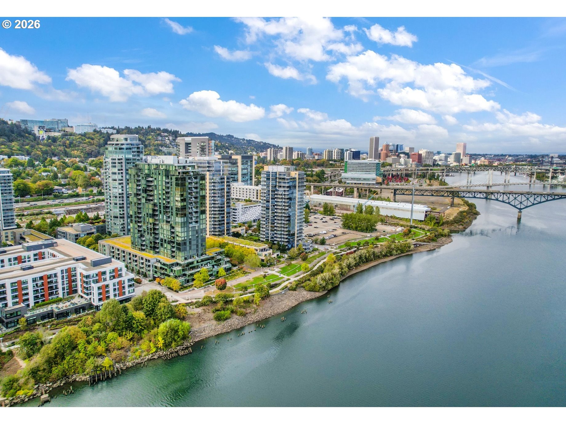 a view of a city with lawn chairs