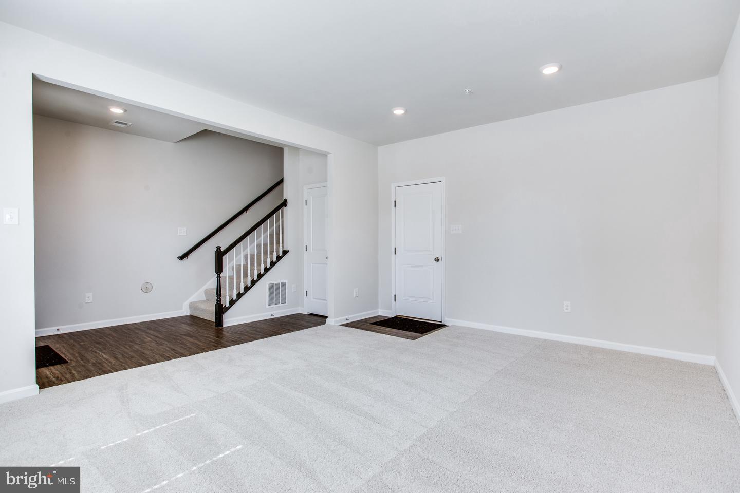 7068 Delegate Place Frederick, MD 21703 - Photo 12 of 76 a view of an empty room with stairs